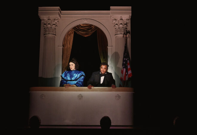 Mary and her husband side by side in the presidential box at the theater, from the Broadway production